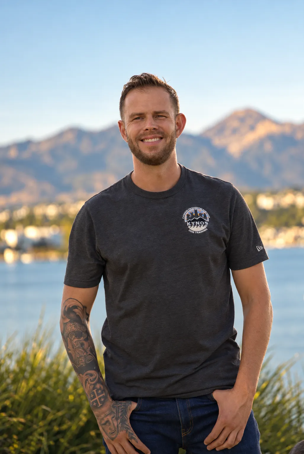 Jake, the Kynos dog trainer, smiling outdoors by the lake in Orange County
