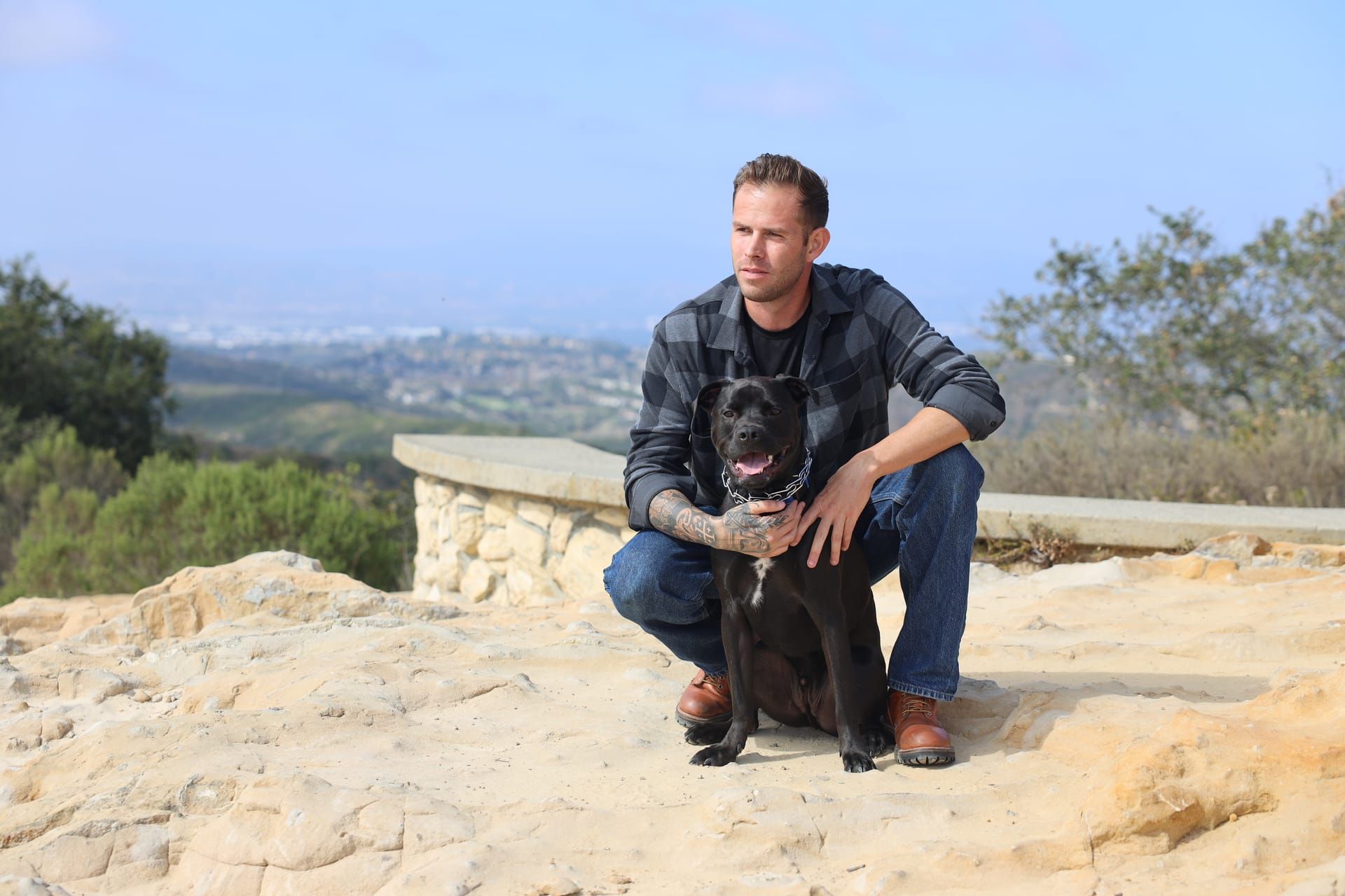 Jake with dog at scenic overlook in Orange County